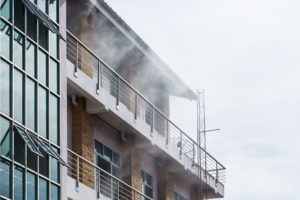 Smoke exiting the front of a high rise building